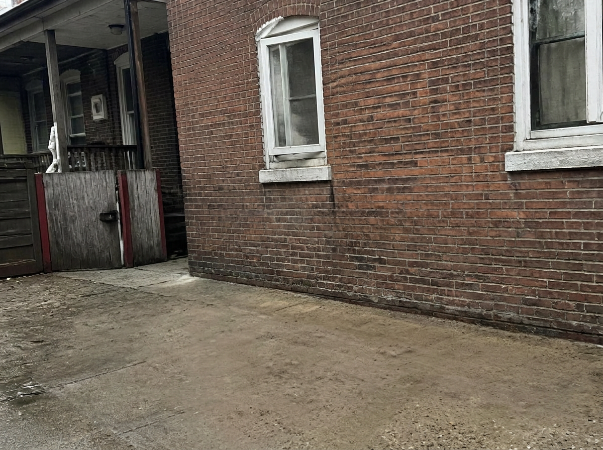 Same Baltimore rowhouse alley completely cleared and clean after Charm City Haulers junk removal